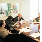 People sitting round desk having a meeting